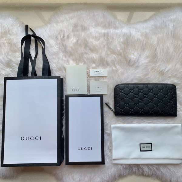 G*u*i leather zip around wallet
